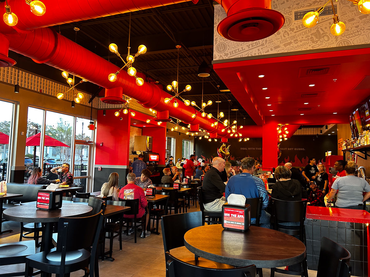 inside restaurant with black and red decor
